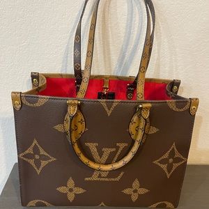Designer dup handbag. New, never been used.  Very similar to the MM OnTheGo